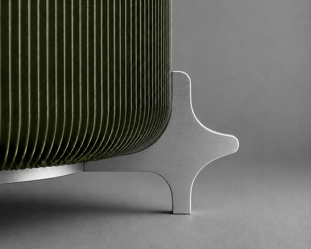 Close up of the AERO olive green ribbed designer table lamp showing its translucent textured shade and precision machined aluminium support leg.