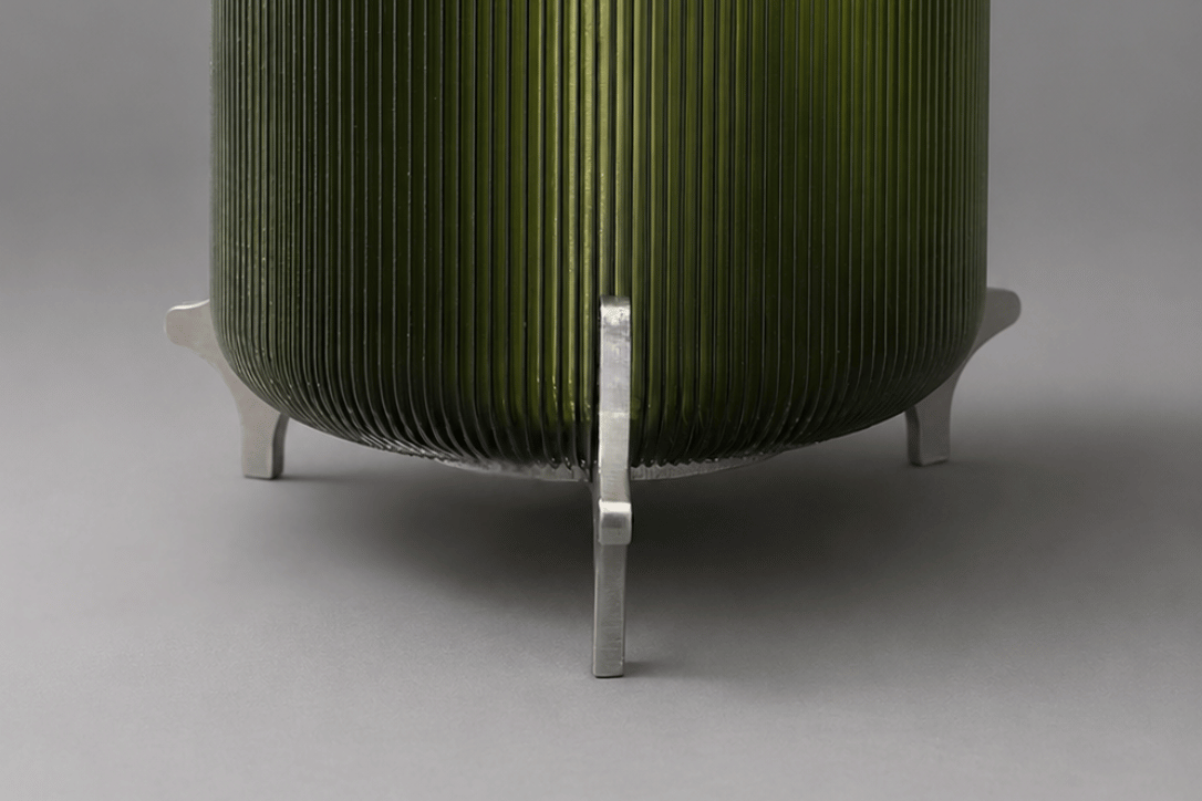 AERO olive green translucent designer table lamp by Natalia Design Co. featuring a ribbed PETG diffuser and sculptural satin aluminium legs in a contemporary industrial design.